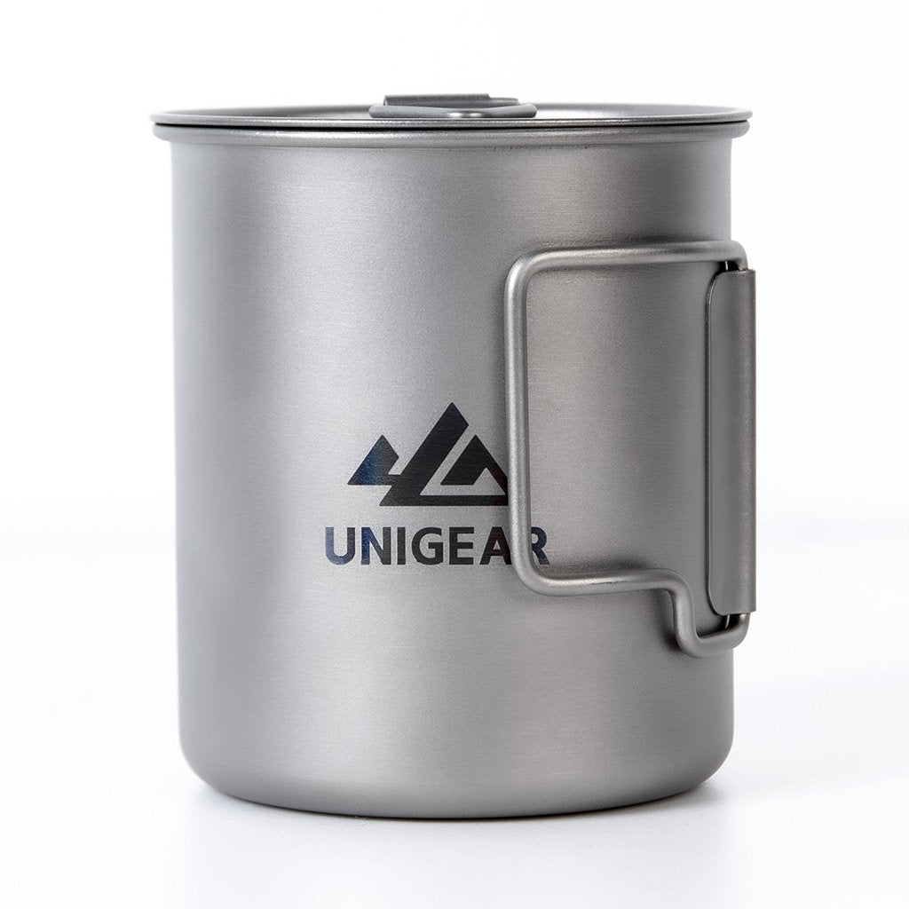 Lightweight 100% titanium camping cup with a 450ml capacity, featuring folding handles and a sleek, durable design.