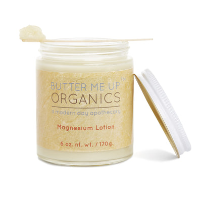 Soothing organic magnesium lotion in a glass jar with a metal lid, blended with lavender and natural oils for hydration.