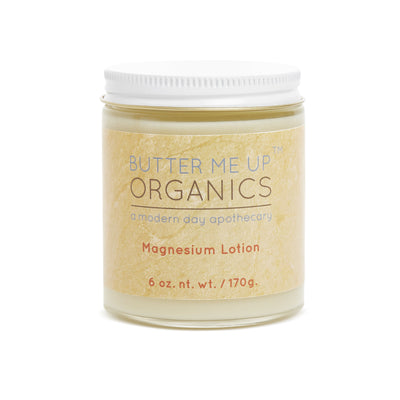 Smooth organic magnesium lotion in a glass jar, infused with lavender and shea, perfect for hydrating skin and relaxation.