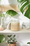 Silky organic magnesium lotion in a glass jar with a metal lid, infused with lavender and shea for soothing hydration.