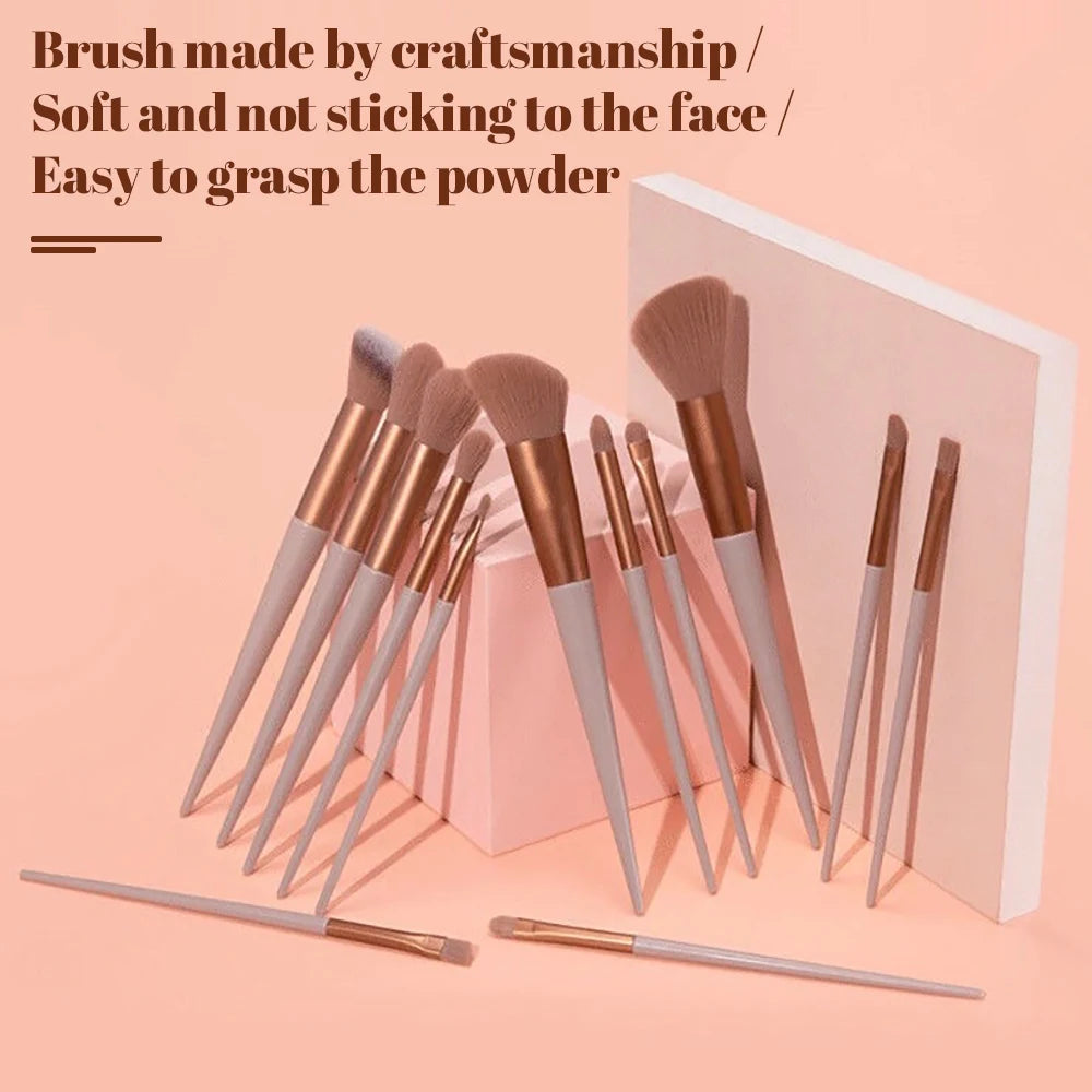 Stunning set of 13 makeup brushes for eyeshadow and foundation, featuring soft bristles and sleek black handles.