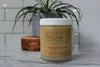 Silky organic magnesium lotion in a glass jar with a metal lid, infused with lavender and shea for soothing hydration.