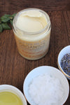 Smooth organic magnesium lotion in a glass jar, infused with lavender and shea, perfect for hydrating skin and relaxation.