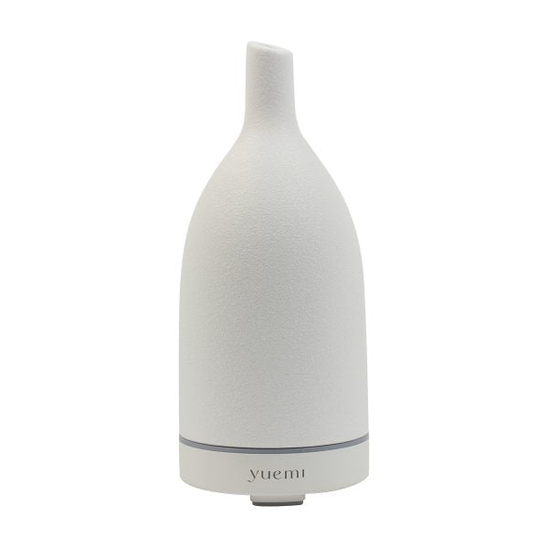 Elegant Yuemi ceramic essential oil diffuser in a minimalist stone design, adding modern charm to any room.